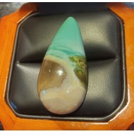 Sold 39.80Ct Story Opalized Wood Pear Shape that is a natural painted nature scene
